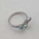 Серебряное кольцо Цветок белый с голубым фианитом k111600, 17 размер