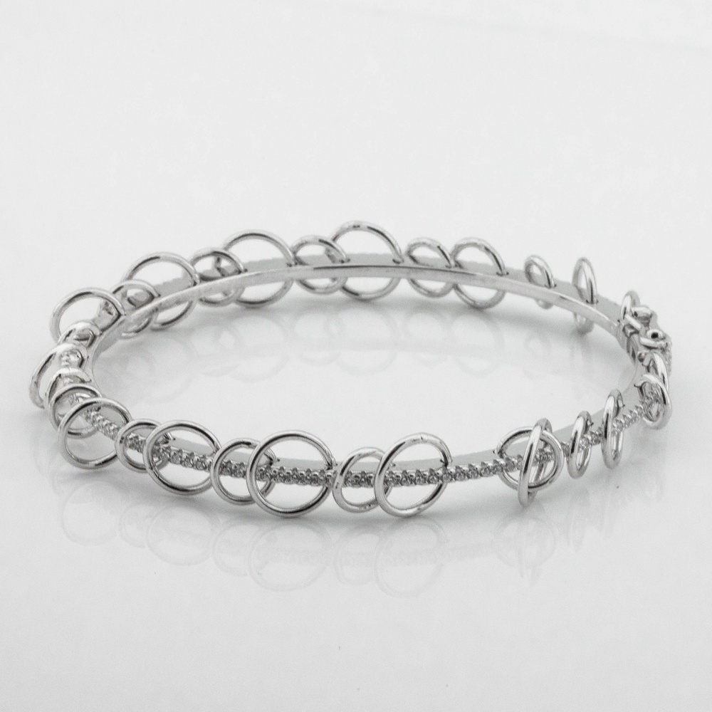 Жорсткий срібний браслет з кільцями з фіанітами b15870