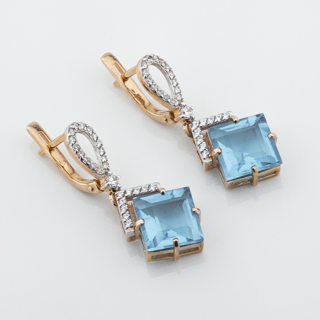 Золоті сережки-підвіски Ромбики з блакитним синт. топазом 12950top